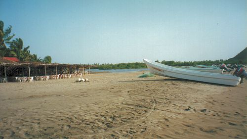 Enramada restaurants fronting the beach at Barra de Potos&iacute;, Guerrero, Mexico